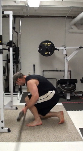 One-Arm Barbell Floor Press In Single-Leg Bridge Position