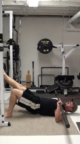 One-Arm Barbell Floor Press In Single-Leg Bridge Position