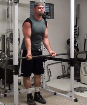 Rack-Leaning Barbell Curls to Wake Up Your Bicep Muscle Fibers