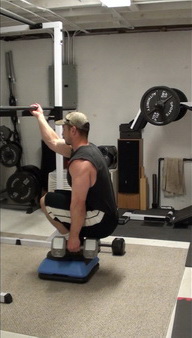 Get a better butt with this squat exercise - bottom position