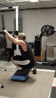 Get a better butt with this squat exercise - bottom position